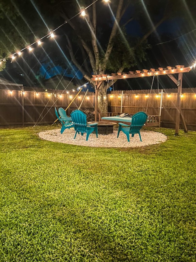 1501 SE 4th St, Grand Prairie, TX 75051 - fenced backyard with an outdoor fire pit