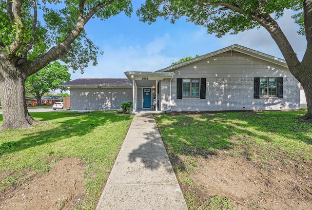 1501 SE 4th St, Grand Prairie, TX 75051 - single story home featuring brick siding and a front lawn