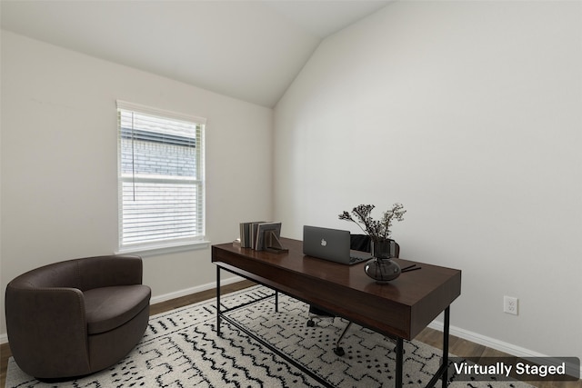 home office with baseboards, wood finished floors, and vaulted ceiling