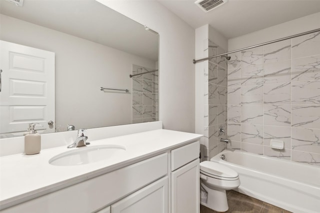 full bathroom with visible vents, toilet,  shower combination, and vanity