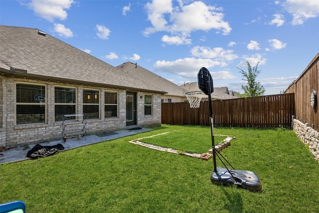 view of yard with a fenced backyard