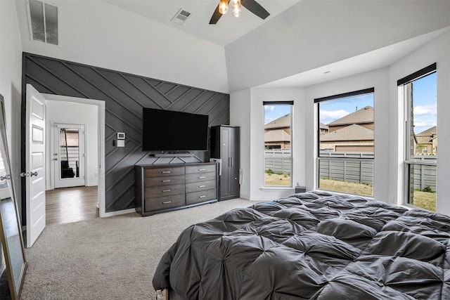 7005 Lowbranch Trl, Little Elm, TX 76227 - bedroom with visible vents, ceiling fan, light colored carpet, and a towering ceiling