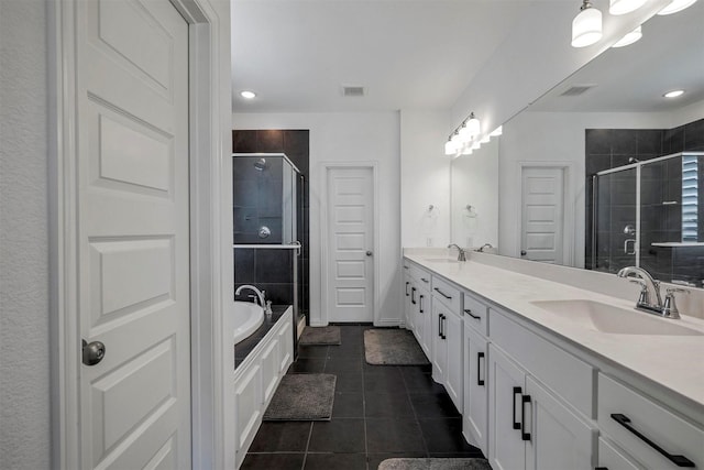 7005 Lowbranch Trl, Little Elm, TX 76227 - full bath featuring tile patterned floors, double vanity, a stall shower, and a sink