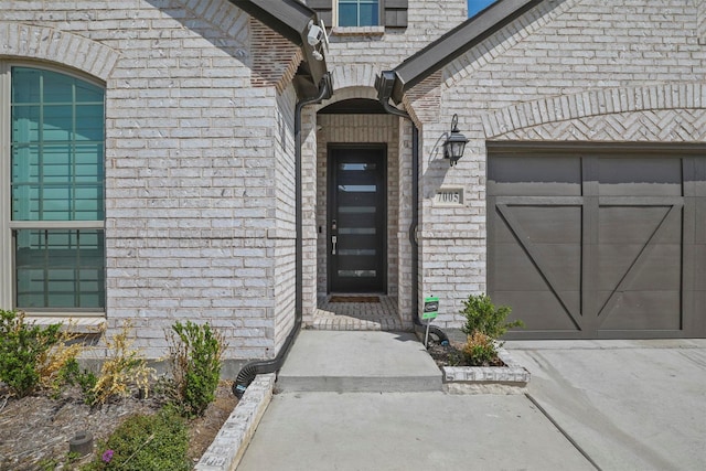 7005 Lowbranch Trl, Little Elm, TX 76227 - entrance to property with brick siding, driveway, and an attached garage