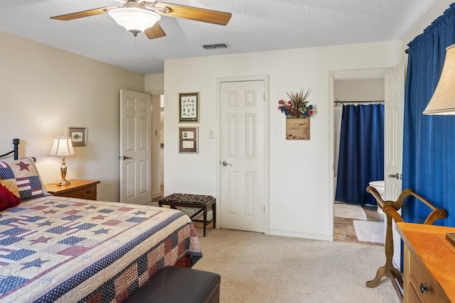 bedroom featuring visible vents, a ceiling fan, and carpet floors