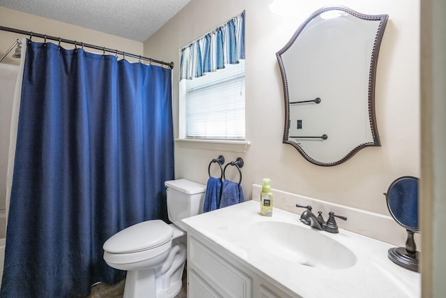 bathroom with curtained shower, toilet, a textured ceiling, and vanity