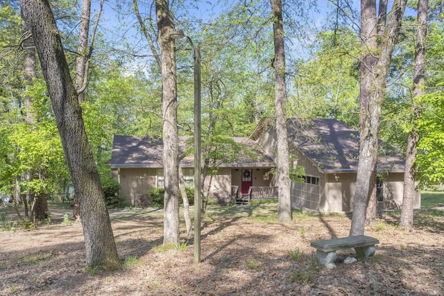 view of front of home featuring roof with shingles