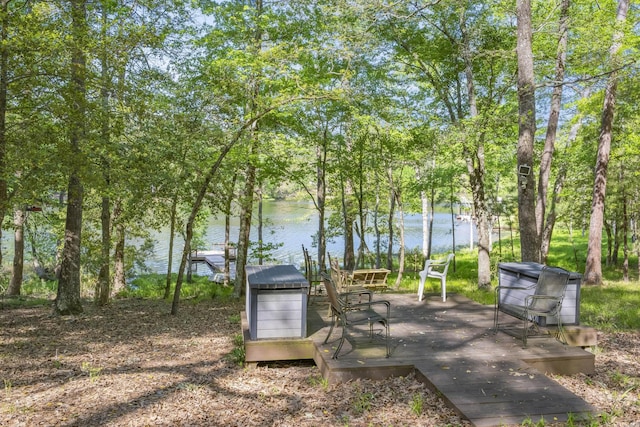 exterior space with a deck with water view