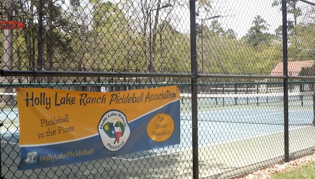 view of sport court with fence