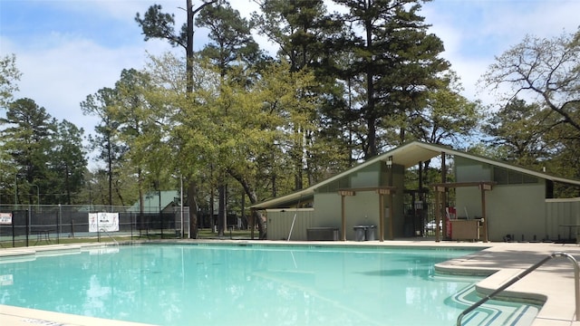 community pool featuring fence