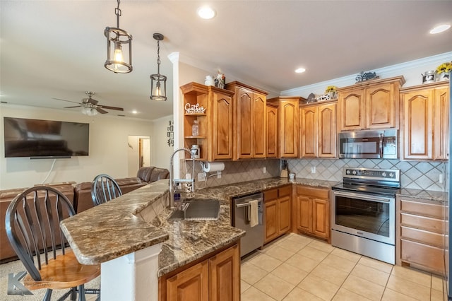 kitchen featuring a kitchen breakfast bar, appliances with stainless steel finishes, open shelves, a sink, and a peninsula