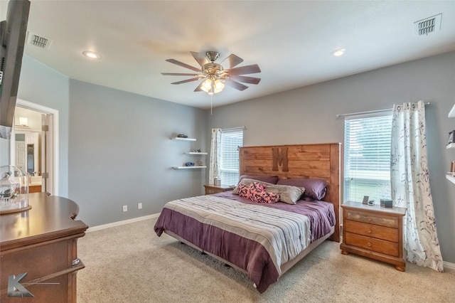 bedroom featuring a ceiling fan, baseboards, visible vents, and light carpet