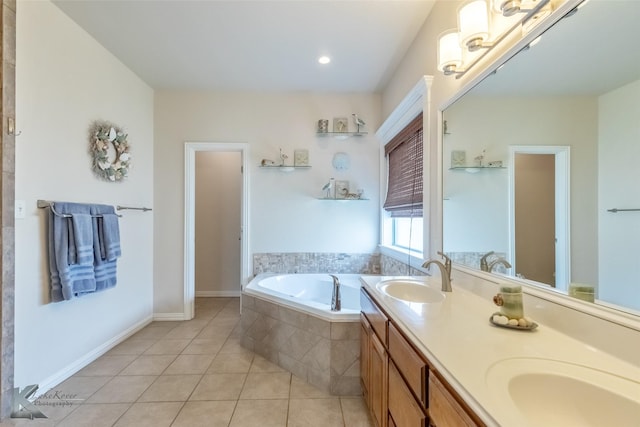 bathroom featuring double vanity, a sink, a bath, and tile patterned floors