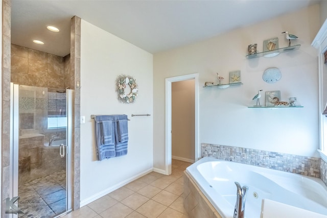 full bathroom with tile patterned floors, recessed lighting, baseboards, a bath, and a stall shower