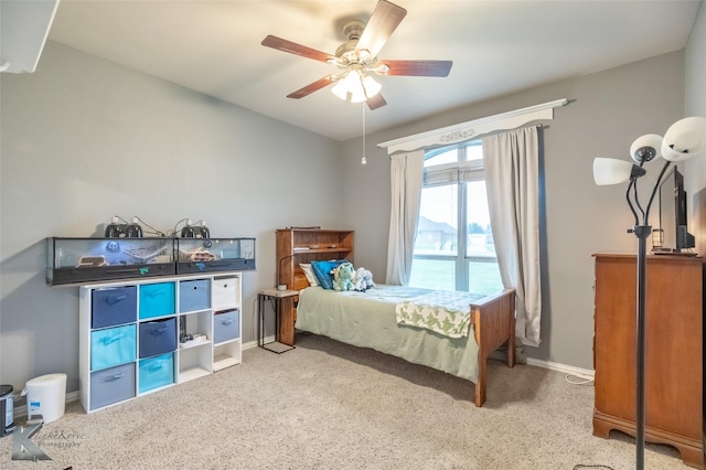 bedroom featuring baseboards, ceiling fan, carpet, and vaulted ceiling