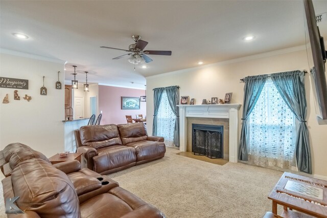 carpeted living room featuring a ceiling fan, recessed lighting, ornamental molding, and a fireplace