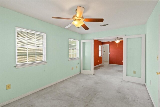 5841 Tracyne Dr, Westworth Village, TX 76114 - spare room featuring a ceiling fan, visible vents, carpet, and baseboards