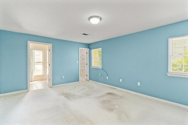 5841 Tracyne Dr, Westworth Village, TX 76114 - carpeted spare room with baseboards and visible vents