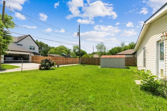 5841 Tracyne Dr, Westworth Village, TX 76114 - view of yard featuring an outdoor structure, a storage unit, and a fenced backyard