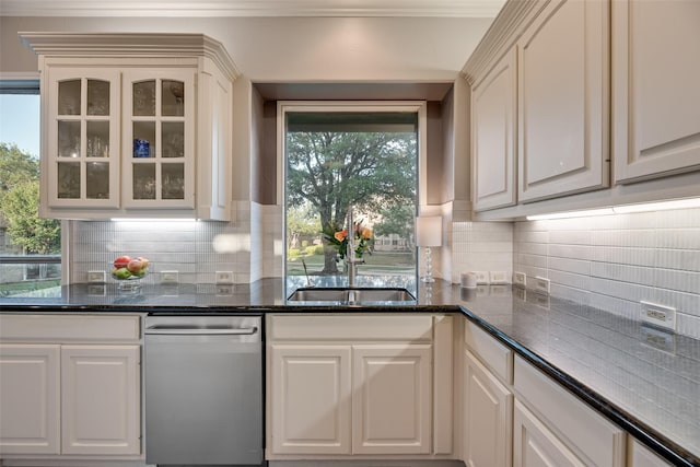 kitchen featuring tasteful backsplash, stainless steel dishwasher, crown molding, and glass insert cabinets