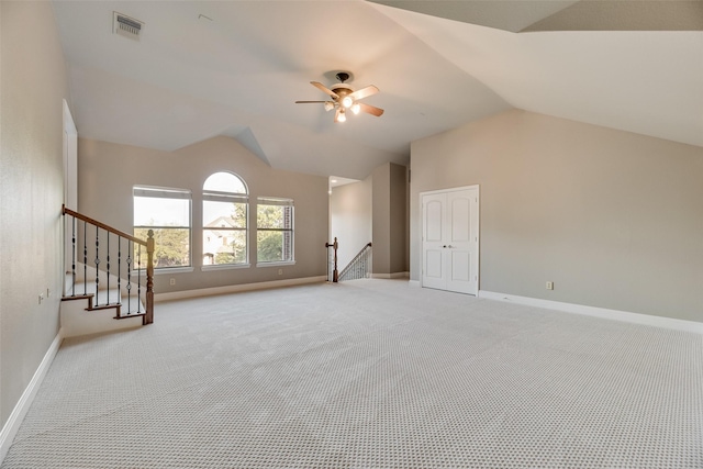 additional living space featuring vaulted ceiling, light carpet, ceiling fan, baseboards, and visible vents