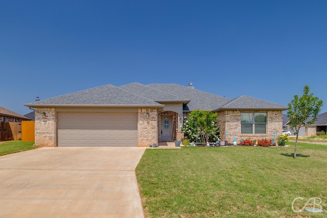 ranch-style house featuring a garage, brick siding, driveway, and a front yard