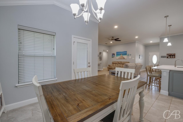 dining room with crown molding, light tile patterned floors, and baseboards