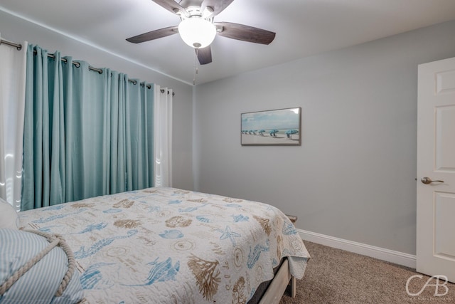 carpeted bedroom with baseboards and ceiling fan