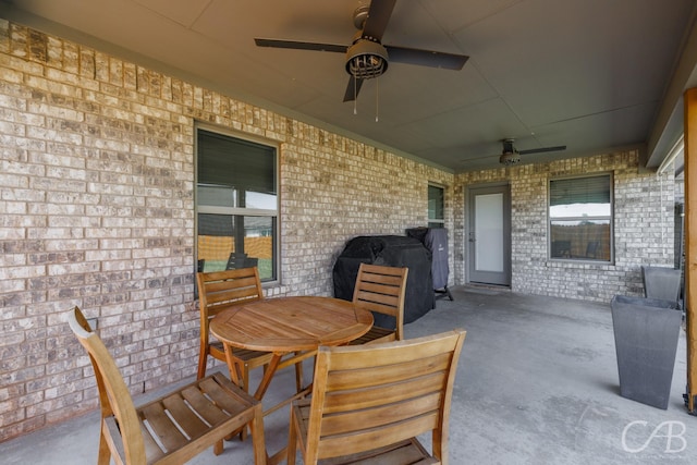 view of patio / terrace featuring a ceiling fan and outdoor dining space