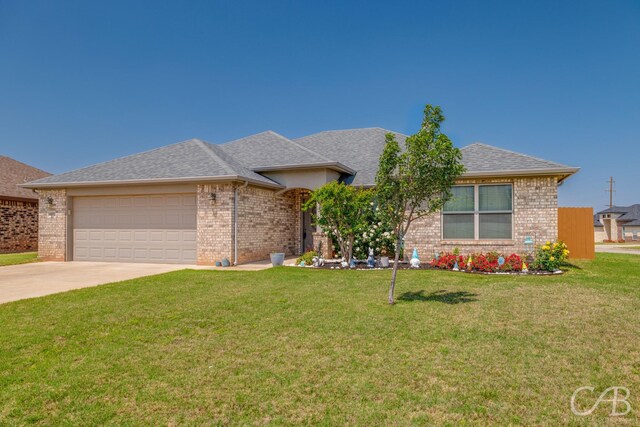 ranch-style home featuring concrete driveway, a front yard, brick siding, and a garage