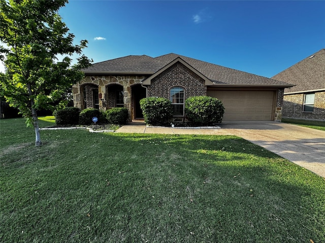 101 Holly St, Waxahachie, TX 75165 - french country style house with concrete driveway, a garage, a front lawn, and brick siding