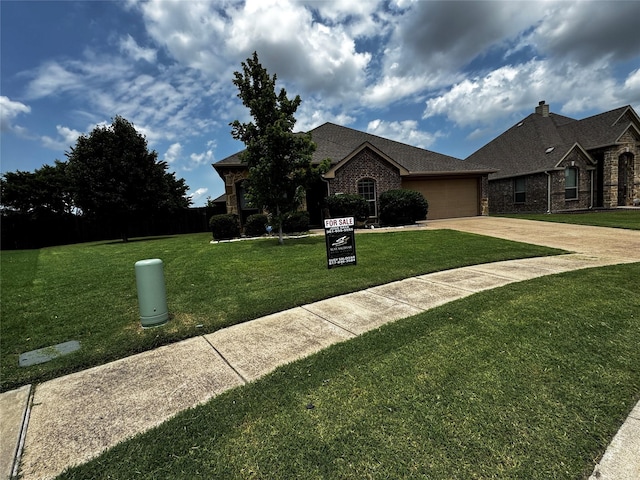 101 Holly St, Waxahachie, TX 75165 - view of front of home featuring driveway, a front yard, brick siding, and a garage