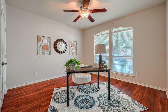 home office featuring baseboards, wood finished floors, and a ceiling fan