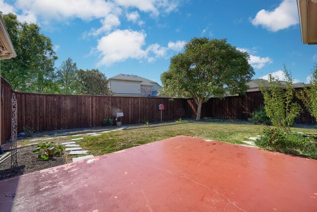 view of yard featuring a patio and a fenced backyard