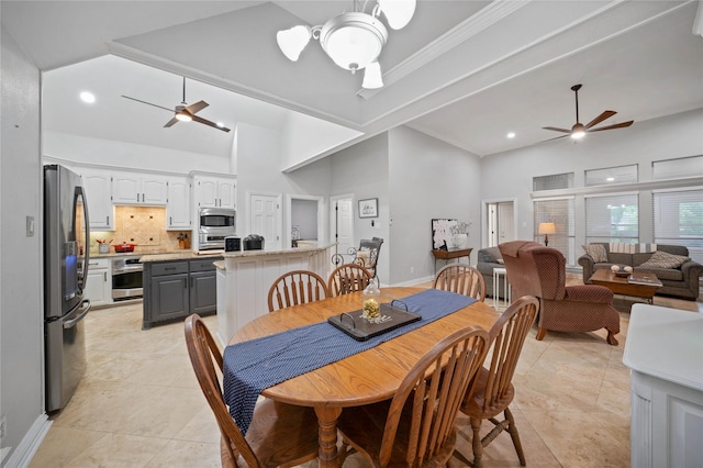 dining space featuring light tile patterned floors, recessed lighting, ceiling fan, and high vaulted ceiling