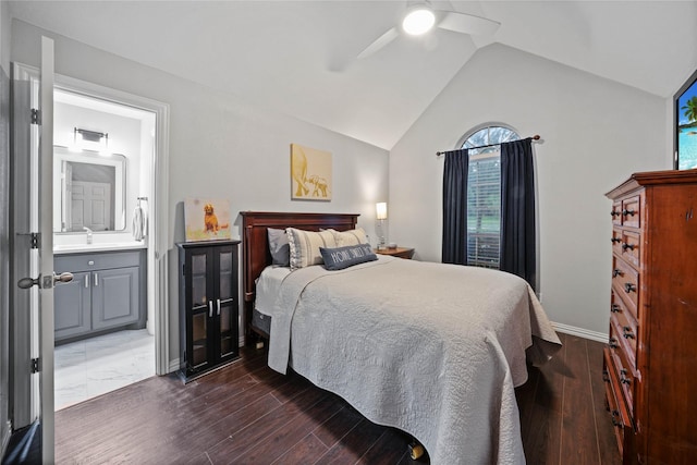 bedroom featuring baseboards, ensuite bathroom, dark wood-style floors, a ceiling fan, and lofted ceiling