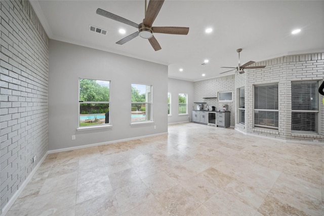unfurnished living room with recessed lighting, brick wall, crown molding, a ceiling fan, and visible vents