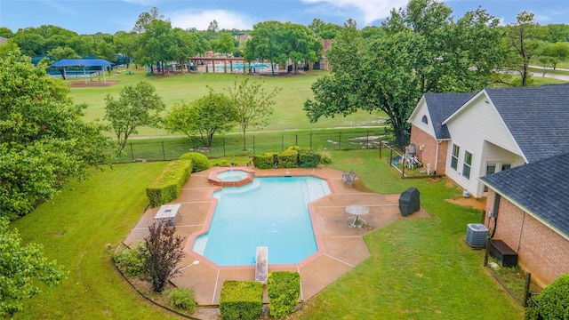 201 Southridge Lakes Parkway, Southlake, TX 76092 - view of swimming pool with central air condition unit, a patio area, and a pool with connected hot tub
