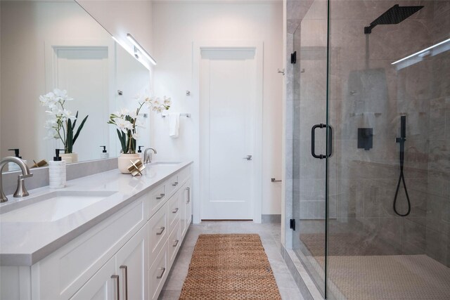 4517 Munger Ave Unit 106, Dallas, TX 75204 - bathroom with a stall shower, double vanity, and tile patterned flooring