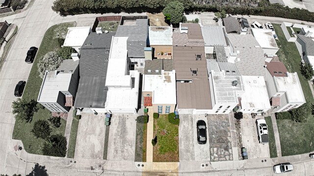 birds eye view of property with a residential view