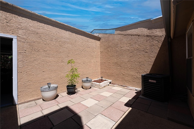exterior details with stucco siding and central air condition unit