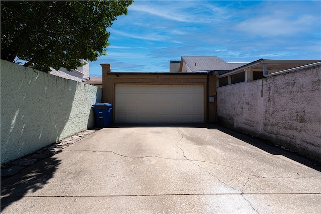 garage featuring driveway