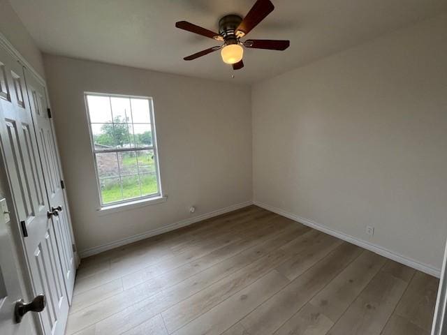 610 N Pecan St, Hico, TX 76457 - empty room with baseboards, a ceiling fan, and light wood-style floors