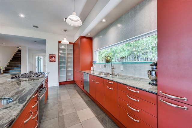 1580 Stemmons Ave, Dallas, TX 75208 - kitchen with a sink, appliances with stainless steel finishes, decorative backsplash, recessed lighting, and pendant lighting