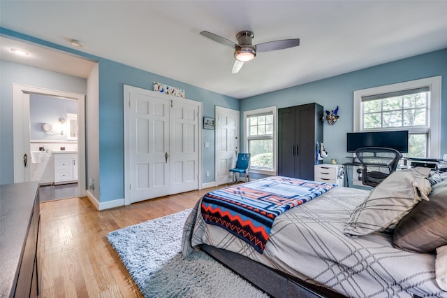 1580 Stemmons Ave, Dallas, TX 75208 - bedroom with light wood finished floors, baseboards, and a ceiling fan