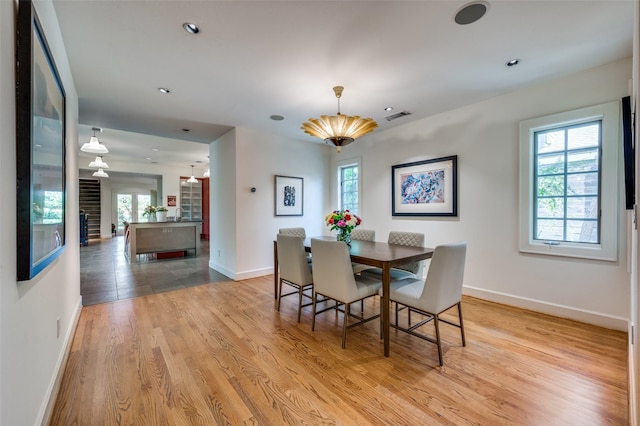 1580 Stemmons Ave, Dallas, TX 75208 - dining room featuring plenty of natural light, baseboards, light wood finished floors, and recessed lighting
