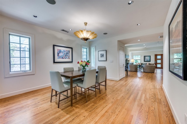 1580 Stemmons Ave, Dallas, TX 75208 - dining room featuring light wood-style floors, healthy amount of natural light, and recessed lighting