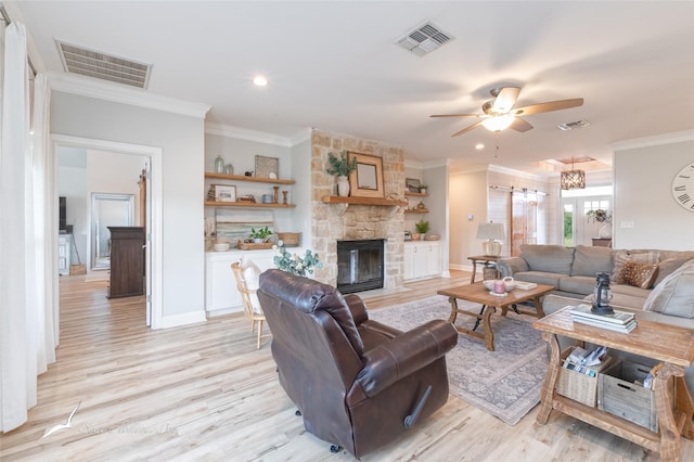 living room featuring visible vents and crown molding