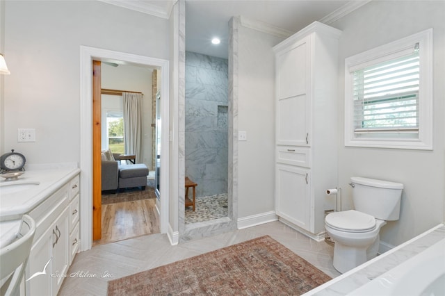 full bathroom with toilet, a tile shower, crown molding, and vanity