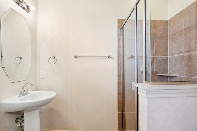 full bathroom with a shower stall